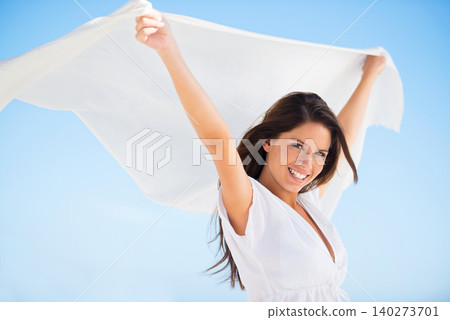Portrait, smile and woman with sarong in wind outdoor for summer, vacation and travel on holiday. Face, happy person and fly with silk fabric in the air for freedom, beauty and breeze on blue sky Portrait, smile and woman with sarong in wind outdoor for summer, vacation and travel on holiday. Face, happy person and fly with silk fabric in the air for freedom, beauty and breeze on blue sky 140273701
