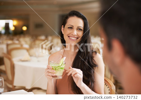 Happy woman, date and fine dining with drink for romance, love or bonding on anniversary at restaurant. Young woman smile with man on romantic dinner for good beverage, celebration or valentines day Happy woman, date and fine dining with drink for romance, love or bonding on anniversary at restaurant. Young woman smile with man on romantic dinner for good beverage, celebration or valentines day 140273732