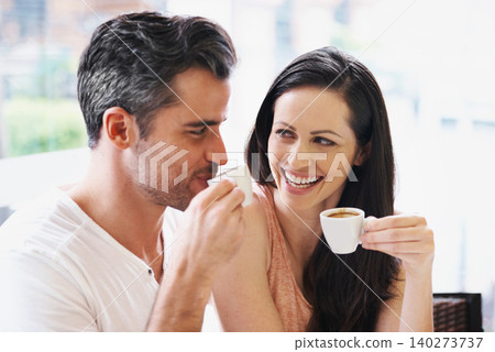 Happy, discussion and couple with coffee on date for romance or anniversary in cafeteria. Love, bonding and young man and woman talking and drinking latte, espresso or cappuccino at restaurant. Happy, discussion and couple with coffee on date for romance or anniversary in cafeteria. Love, bonding and young man and woman talking and drinking latte, espresso or cappuccino at restaurant. 140273737