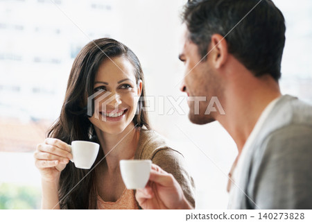 Happy, conversation and couple with coffee on date for romance or anniversary in cafeteria. Love, bonding and young man and woman talking and drinking latte, espresso or cappuccino at restaurant. Happy, conversation and couple with coffee on date for romance or anniversary in cafeteria. Love, bonding and young man and woman talking and drinking latte, espresso or cappuccino at restaurant. 140273828