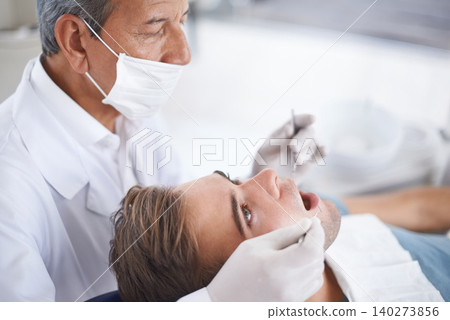 Dental care, man and dentist with tools for healthcare, gum disease or oral hygiene with mouth inspection. Medical, orthodontics and consultation for teeth health, cleaning or wellness with excavator Dental care, man and dentist with tools for healthcare, gum disease or oral hygiene with mouth inspection. Medical, orthodontics and consultation for teeth health, cleaning or wellness with excavator 140273856