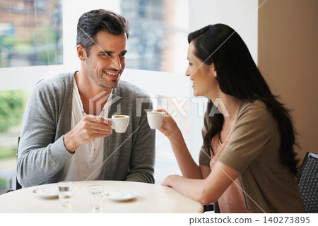 Love, conversation and couple with coffee on date for romance or anniversary in cafeteria. Happy, bonding and young man and woman talking and drinking latte, espresso or cappuccino at restaurant. Love, conversation and couple with coffee on date for romance or anniversary in cafeteria. Happy, bonding and young man and woman talking and drinking latte, espresso or cappuccino at restaurant. 140273895