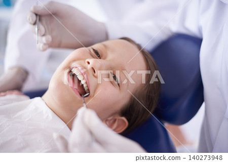 Girl, child and hands with tools for dental, gum disease and oral hygiene with mouth inspection and face. Medical, orthodontics and consultation for teeth health, happiness or wellness with excavator 140273948