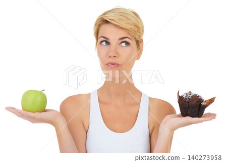 Woman, fitness and health for diet option, nutrition and decision by studio for lifestyle. Female person, athlete and decide for food, workout and white background with apple and cake choice Woman, fitness and health for diet option, nutrition and decision by studio for lifestyle. Female person, athlete and decide for food, workout and white background with apple and cake choice 140273958