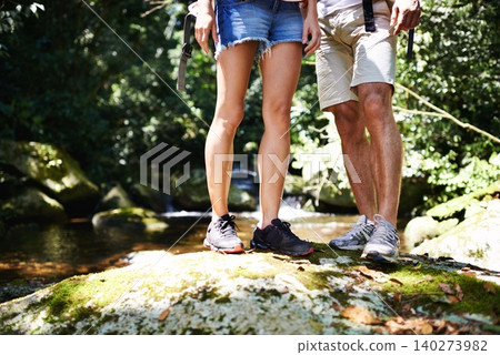Hiking, rock or legs of couple in nature, forest or park on a trekking adventure on outdoor holiday. Man, woman or people in woods for travel or journey with footwear, shoes or wellness on vacation Hiking, rock or legs of couple in nature, forest or park on a trekking adventure on outdoor holiday. Man, woman or people in woods for travel or journey with footwear, shoes or wellness on vacation 140273982