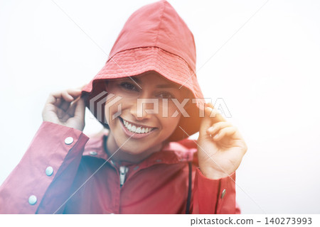 Happy woman, portrait and red rain jacket with hat for weather, cloudy sky or winter season in outdoor storm. Face of female person with waterproof coat and smile for protection, fog or cold overcast Happy woman, portrait and red rain jacket with hat for weather, cloudy sky or winter season in outdoor storm. Face of female person with waterproof coat and smile for protection, fog or cold overcast 140273993