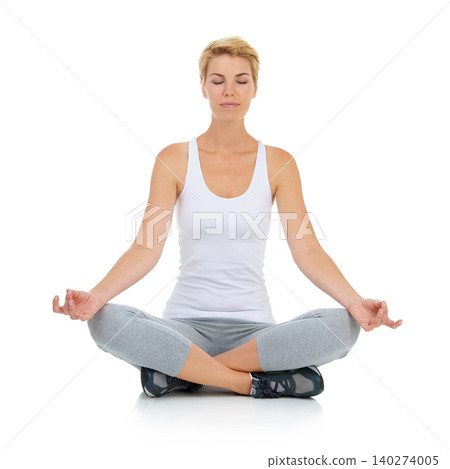 Woman, lotus pose with yoga and meditation in studio with mindfulness and peace of mind on white background. Exercise, wellness and health with chakra balance for holistic healing, spiritual and zen Woman, lotus pose with yoga and meditation in studio with mindfulness and peace of mind on white background. Exercise, wellness and health with chakra balance for holistic healing, spiritual and zen 140274005