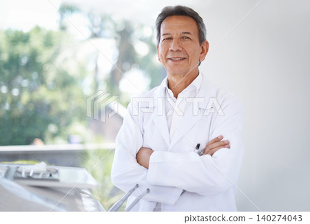 Portrait, dentist and man in clinic with confidence in expert advice, orthodontics and medical health. Dental medicine, healthcare and professional with pride, arms crossed and trust in oral service. 140274043