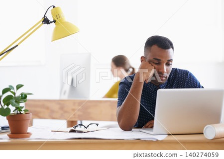 African architect, depressed and tired from failed project, upset and mockup space. Nigerian male, sad and exhausted with laptop, documents and frustrated by illustrations, designs or drawings African architect, depressed and tired from failed project, upset and mockup space. Nigerian male, sad and exhausted with laptop, documents and frustrated by illustrations, designs or drawings 140274059