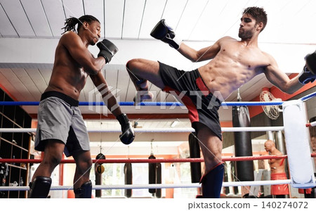 Kickboxing, fight and men training for fitness and sport in gym, coach and athlete with workout and action. Energy, challenge and MMA with athlete together in ring for boxing, exercise and endurance Kickboxing, fight and men training for fitness and sport in gym, coach and athlete with workout and action. Energy, challenge and MMA with athlete together in ring for boxing, exercise and endurance 140274072