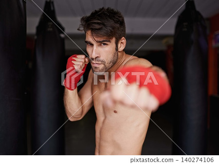 Boxer, gym and portrait for fitness, punch and wellness in strong training for confidence to fight. Man, sport and boxing athlete in sports, challenge and shirtless ready to exercise for mma Boxer, gym and portrait for fitness, punch and wellness in strong training for confidence to fight. Man, sport and boxing athlete in sports, challenge and shirtless ready to exercise for mma 140274106