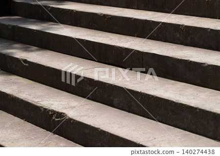 A background image of a stone staircase at a shrine, viewed from an angle. A background image of a stone staircase at a shrine, viewed from an angle. 140274438