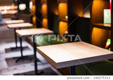 Table seating in a relaxed restaurant Table seating in a relaxed restaurant 140275313