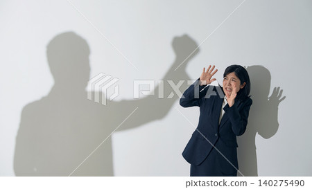 Female businessperson criticized for showing a male silhouette Female businessperson criticized for showing a male silhouette 140275490