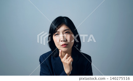 A woman thinking A woman thinking 140275516