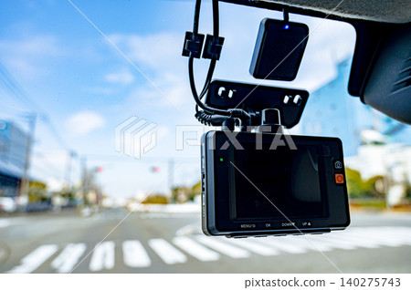 Dashcam footage from inside a car driving through an intersection Dashcam footage from inside a car driving through an intersection 140275743
