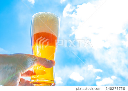 Backlit blue sky and a beer glass Backlit blue sky and a beer glass 140275758