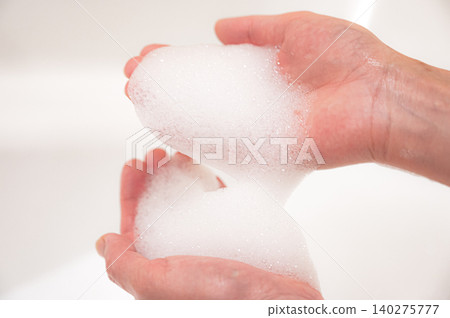 Image of hand washing with soap on both hands Image of hand washing with soap on both hands 140275777