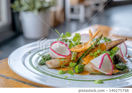 Fish dish with colorful vegetables Fish dish with colorful vegetables 140275786