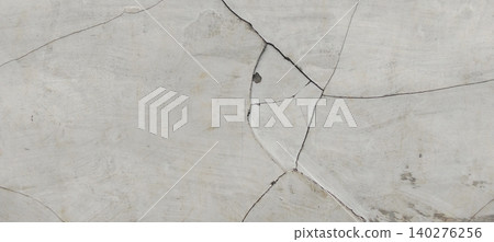 Abstract cracked concrete wall texture with structural fracture pattern Abstract cracked concrete wall texture with structural fracture pattern 140276256