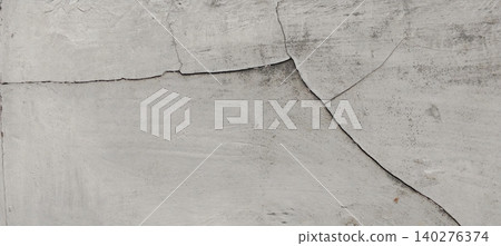 The background texture of a cracked concrete wall with a weathered surface The background texture of a cracked concrete wall with a weathered surface 140276374