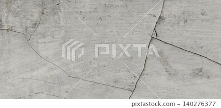 The background texture of a cracked concrete wall with a weathered surface The background texture of a cracked concrete wall with a weathered surface 140276377