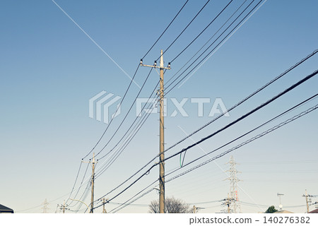 Blue sky and telephone poles Blue sky and telephone poles 140276382