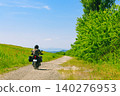 Motorcycles riding through the summer wilderness 140276953
