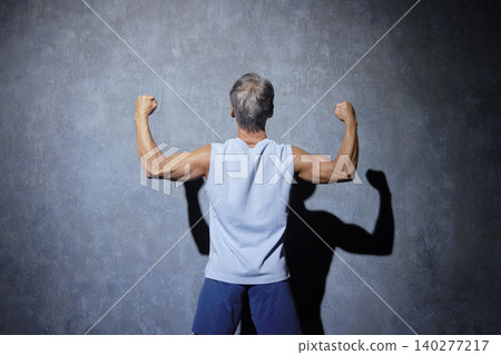 Senior man wearing sportswear posing, back view Senior man wearing sportswear posing, back view 140277217