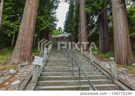 View of the main hall from the stone steps leading to Zenpoji Temple in Yamagata. View of the main hall from the stone steps leading to Zenpoji Temple in Yamagata. 140278194