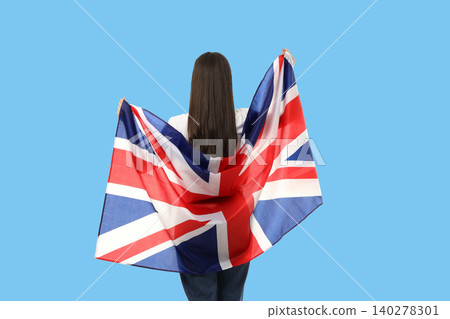 Young woman embraces British flag. Celebration of travel and adventure concept Young woman embraces British flag. Celebration of travel and adventure concept 140278301