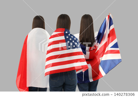 Women showcase flags representing different nations 140278306