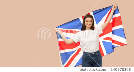 Woman waves British flag in joyful moment. Freedom and cultural pride concept Woman waves British flag in joyful moment. Freedom and cultural pride concept 140278308