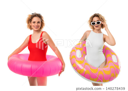 Models wear vibrant swimsuits with playful rings. Summer fashion and fun beach concept, PNG Models wear vibrant swimsuits with playful rings. Summer fashion and fun beach concept, PNG 140278439