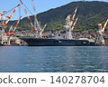 The destroyer "Kaga" is undergoing modifications while docked in Kure Port. 140278704