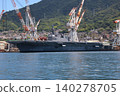 The destroyer "Kaga" is undergoing modifications while docked in Kure Port. 140278705