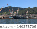 The destroyer "Kaga" is undergoing modifications while docked in Kure Port. 140278706