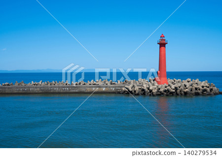 Niigata Port West Breakwater Lighthouse and the silhouette of Sado Island Niigata Port West Breakwater Lighthouse and the silhouette of Sado Island 140279534