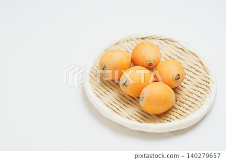 Loquats on a sieve Loquats on a sieve 140279657