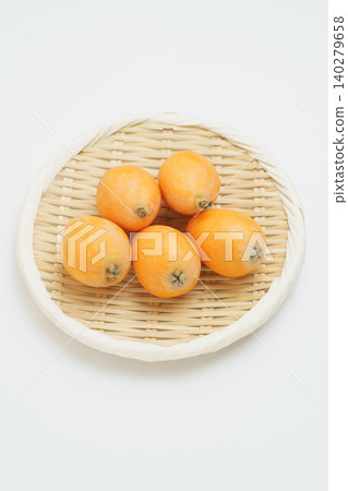 Loquats on a sieve Loquats on a sieve 140279658