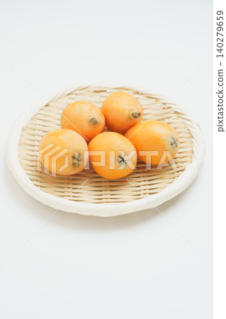 Loquats on a sieve Loquats on a sieve 140279659