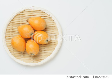 Loquats on a sieve 140279660