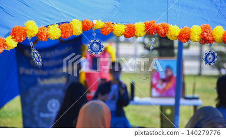 India Day festival in Moscow, marigold garlands decorating a Sahaja Yoga event India Day festival in Moscow, marigold garlands decorating a Sahaja Yoga event 140279776