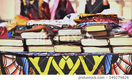 Leather religious Indian books on a street shop table in India. Leather religious Indian books on a street shop table in India. 140279826