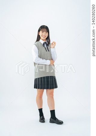 Full-body portrait of a female student in uniform Full-body portrait of a female student in uniform 140280260