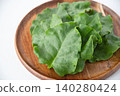 Okinawa spinach served on a wooden plate 140280424