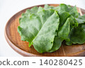 Okinawa spinach served on a wooden plate 140280425