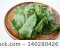 Okinawa spinach served on a wooden plate 140280426