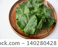 Okinawa spinach served on a wooden plate 140280428