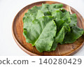 Okinawa spinach served on a wooden plate 140280429